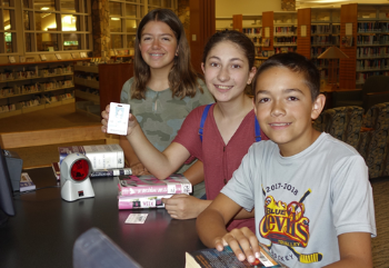 LVJUSD students borrowing materials from Civic Center Library with their student ID cards.